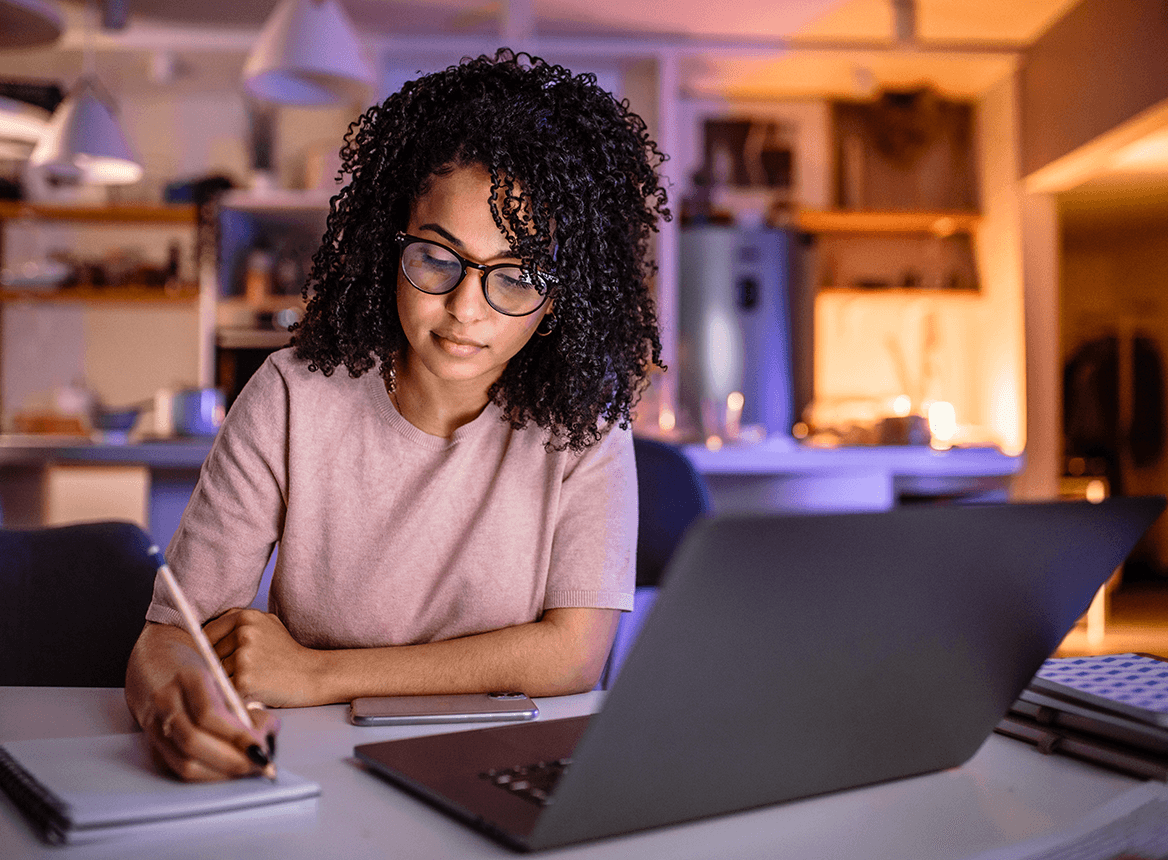 Professional Working at Home Taking Notes